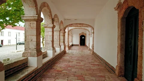 Camera moving backwards and forward towards a door in a stone tounel. Stock Footage 169657912