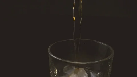 Camera is moving behind a stream of cold tea Stock Footage 87610248