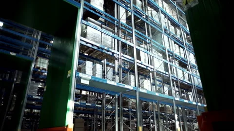 Camera moving between palettes with ordered goods and materials at warehouse. Stock Footage 67334372