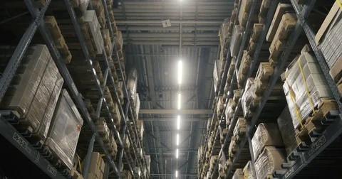 Camera moving between palettes with ordered goods and materials at warehouse 스톡 동영상 85317518