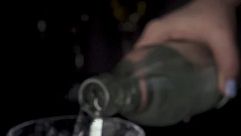 The camera is moving on a bottle with running water slow motion Stock Footage 86689463