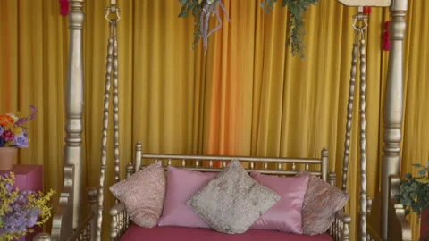 Camera moving up on brightly decorated swinging chair for wedding party Video stock 264556690