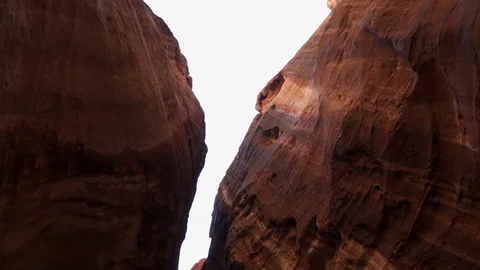 Camera moving in circle with sun flare from the sky between the rocks in Petra Stock Footage 102503798
