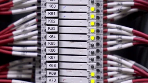 Camera moving down white wire mark with wire connecting in control cabinnet Stock Footage 116041477