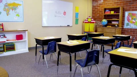 Camera moving in empty school room. Interior of empty classroom with wooden Stock-Footage 256720393