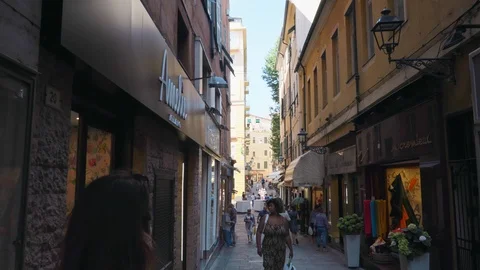 Camera moving forward along the narrow European street with colorful shop. Stock Footage 94024531