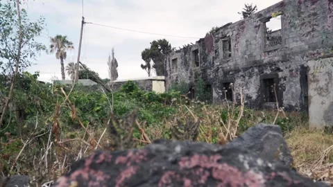 Camera moving forward approaching ruined building Stock Footage 293159181