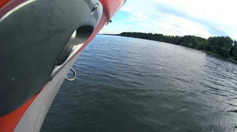 Camera moving forward to coast line by board of the speed boat on lake water Stock Footage 65331152