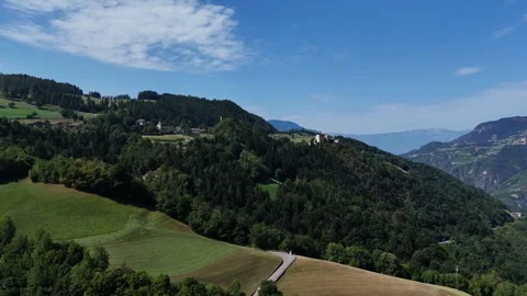 Camera moving forward revealing mountain road and village Video stock 283269974