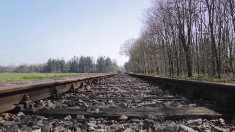 Camera moving forward on rural railroad tracks Video stock 293082839