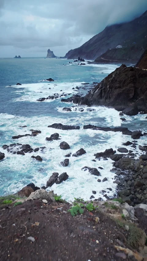 Camera moving forward showing ocean waves crashing on rocks Stock Footage 294287772