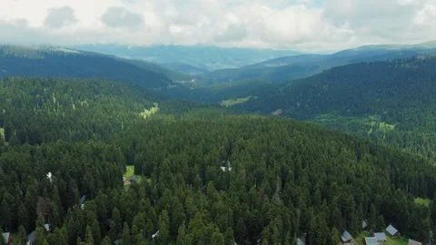 Camera moving forward showing picturesque landscape with mountains and forest Stock Footage 292805409