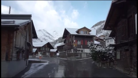 Camera moving forward in snowy swiss village Video stock 291881401