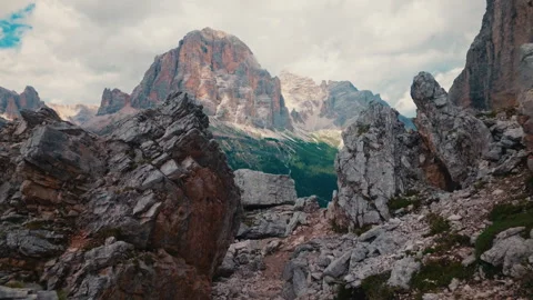 Camera moving forward through stone cliffs to Tofana peak in Dolomites Stock Footage 347020176