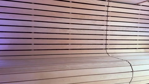 Camera moving inside empty sauna room with purple led lights Stock Footage 294954004