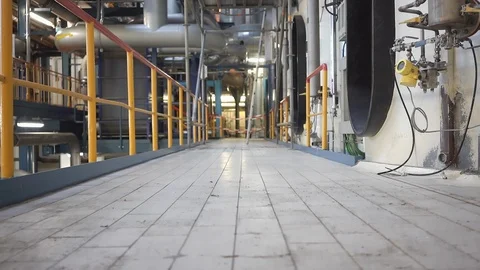Camera Moving Up inside a Factory, View on Security Tape, Scaffolding, Pipes 스톡 동영상 118556744