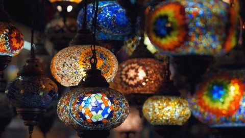 Camera moving from left to right throught traditional turkish lamps at night Stock Footage 105395784