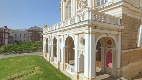 Camera moving up at Odessa Opera and Ballet Theater revealing city center Stock Footage 100892076