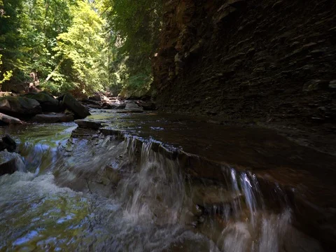 Camera moving over cascading stream in Cuyahoga Valley Stock Footage 77167655