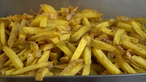 Camera moving over fresh potato fries in a restaurant Stock Footage 118706993