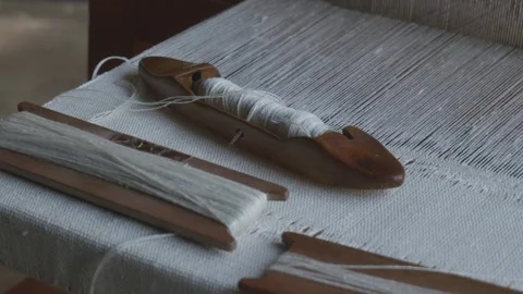 Camera Moving Over Loom with Shuttle and Threads Left to Right Stock Footage 316486531
