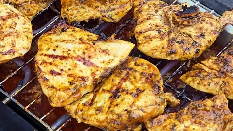 Camera Moving Over Marinated Chicken Breast Grilling on BBQ Grill 库存影片 344703852