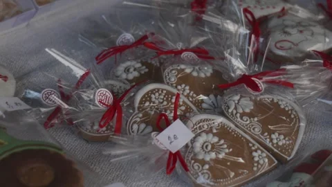 Camera Moving Over Small Wrapped Gingerbread Hearts for Sale Stock Footage 316486690