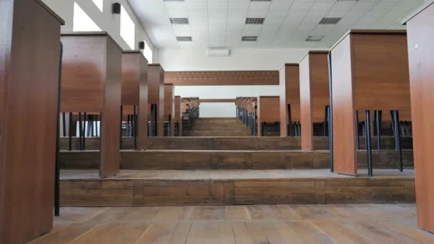 Camera Moving The Passage Between Desks In Empty Conference Hall, Classroom Stock Footage 133495195