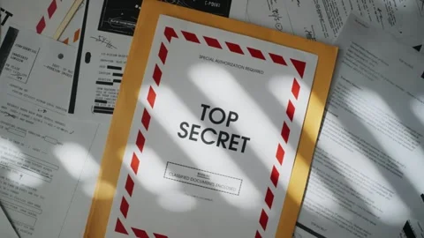Camera moving up from piles of top secret file documents and envelopes in office Stock Footage 304281558