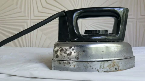 Camera moving to the retro electrical iron on an ironing board Stock Footage 104299309