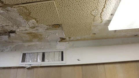 Camera moving from right to left of old, worn ceiling. Stock Footage 97835818