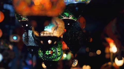 Camera moving from right to left throught traditional turkish lamps at night Stock Footage 105395526