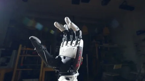 The camera is moving in slow motion around the robot hand, close up Stock Footage 74991177
