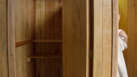 Camera moving through dressing rooms to discover tourist getting dry at a spa Video stock 119801620