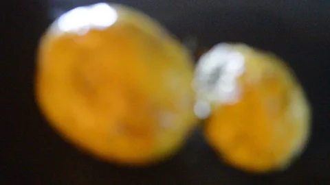 Camera moving through scene for two yellow passion fruits and dramatic light 스톡 동영상 115373466