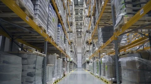 Camera moving through warehouse. racks with merchandise. rows shelves with Stock Footage 124824689