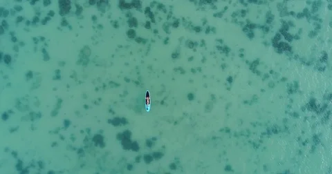 Camera moving from top to down. Attractive woman in bikini is sunbathing on a Stock Footage 84774462