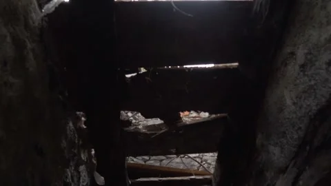 Camera moving under broken wooden roof revealing the sky Stock Footage 293159232