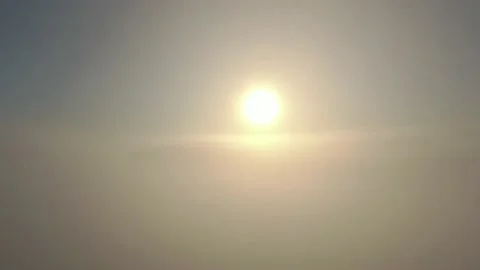 Camera moving upward discovering the sun above the clouds Stock Footage 144146567