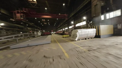 Camera navigates through workshop capturing scale of operations Видео 304412944