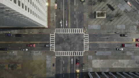 The camera observes traffic from above at an intersection in the center of a Stock Footage 258638442