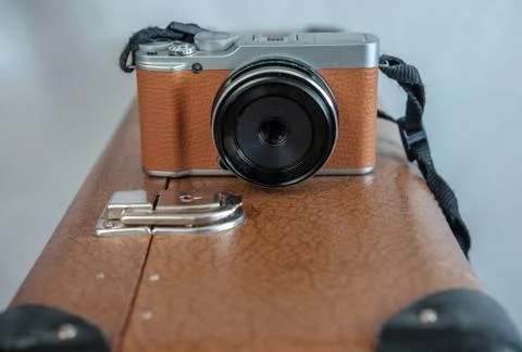 The camera on the old brown suitcase Stock Photos
