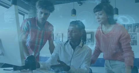 Camera operator adjusting DSLR as team leaning toward monitor, overlays Stock Footage 334116981