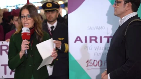 Camera operator and reporter at airline protest Video stock 280798936