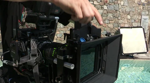 Camera operator changing filter Stock Footage 33940977