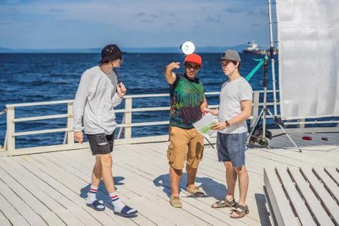 Camera operator, director and dp discuss the process of a commercial video shoot Stock Photos