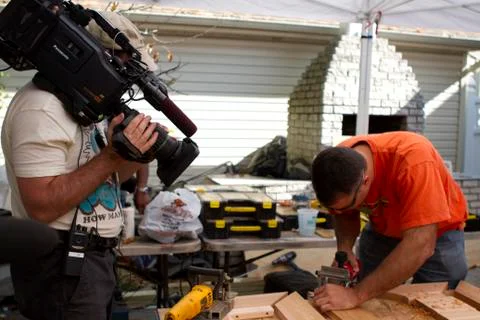 Camera Operator shoots carpenter Stock Photos