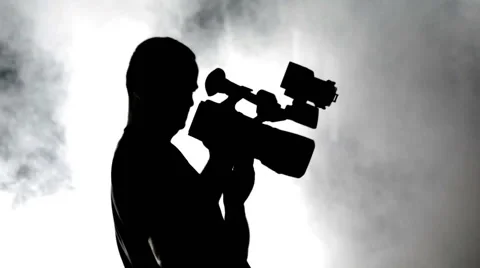 Camera Operator, Silhouette in the smoke Stock Footage 65788129