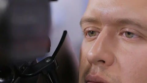 Camera operator working with a cinema broadcast TV camera Stock Footage 94376392