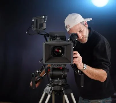 Camera operator working with a cinema camera Photos